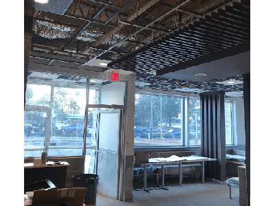 Renovation work with ceiling being installed in a restaurant