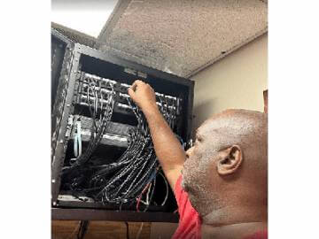 A person working on a computer in a room