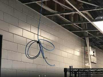 A wire hanging from the ceiling in a room